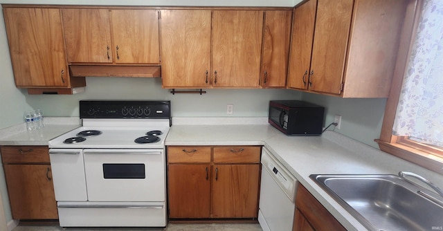 2703 Bosworth Dr, Fort Wayne, IN 46805 - kitchen featuring white appliances, a sink, light countertops, brown cabinetry, and under cabinet range hood