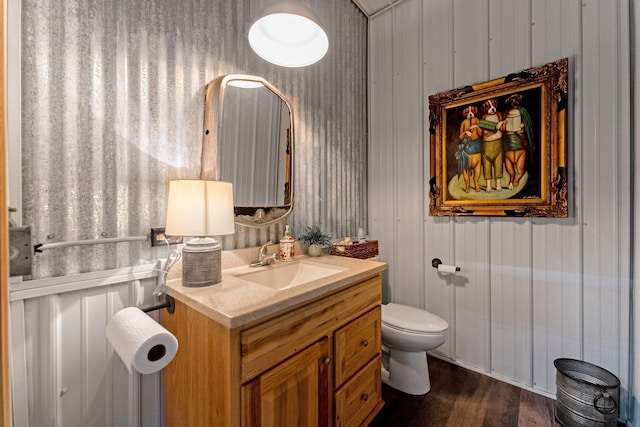 15306 Covington Rd, Fort Wayne, IN 46814 - half bath featuring vanity, toilet, and wood finished floors