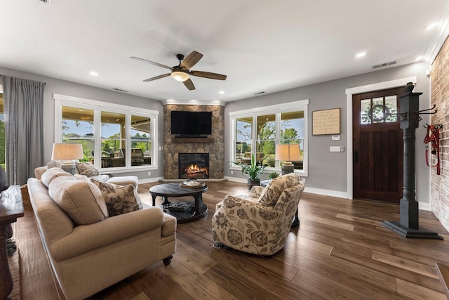 15306 Covington Rd, Fort Wayne, IN 46814 - living room with a ceiling fan, a stone fireplace, dark wood-type flooring, baseboards, and recessed lighting