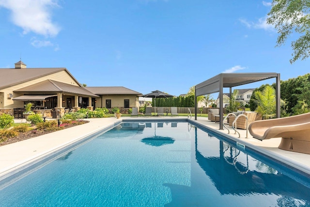 15306 Covington Rd, Fort Wayne, IN 46814 - view of swimming pool with a patio, a water slide, and an outdoor hangout area