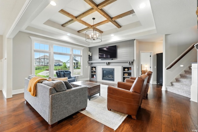 284 Savo Rock Ct, Fort Wayne, IN 46845 - living room featuring stairway, dark wood-style flooring, coffered ceiling, a chandelier, and a glass covered fireplace