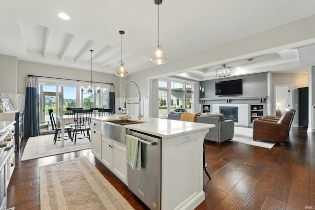 284 Savo Rock Ct, Fort Wayne, IN 46845 - kitchen featuring dishwasher, a sink, dark wood-style floors, a chandelier, and a glass covered fireplace
