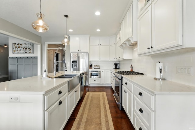 284 Savo Rock Ct, Fort Wayne, IN 46845 - kitchen with stainless steel appliances, decorative backsplash, light countertops, white cabinets, and hanging light fixtures