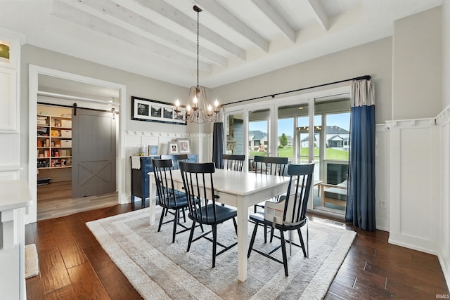 284 Savo Rock Ct, Fort Wayne, IN 46845 - dining area featuring a barn door, beamed ceiling, a chandelier, dark wood finished floors, and a decorative wall