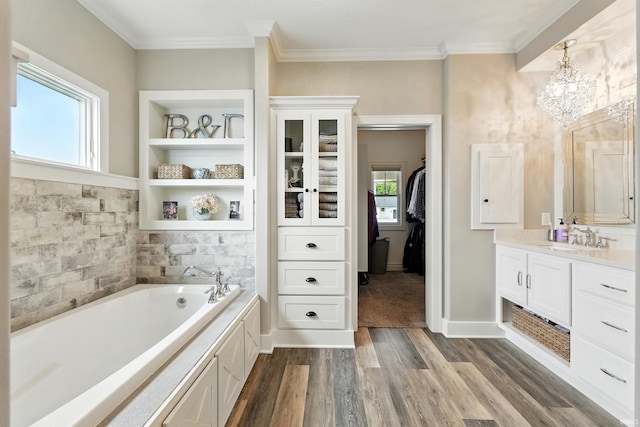 284 Savo Rock Ct, Fort Wayne, IN 46845 - bathroom featuring a bath, a chandelier, vanity, wood finished floors, and ornamental molding