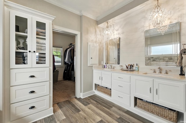 284 Savo Rock Ct, Fort Wayne, IN 46845 - full bath featuring a chandelier, ornamental molding, double vanity, a spacious closet, and wood finished floors
