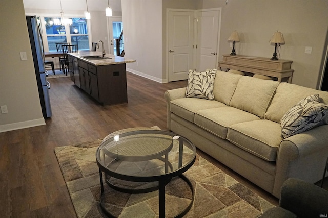 19 Conner St, Wabash, IN 46992 - living area featuring baseboards, dark wood finished floors, and a chandelier