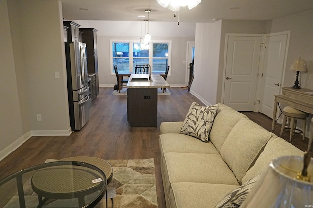 19 Conner St, Wabash, IN 46992 - living area featuring dark wood-style floors, baseboards, and a ceiling fan