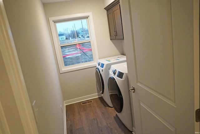 19 Conner St, Wabash, IN 46992 - laundry area with washing machine and dryer, cabinet space, dark wood-type flooring, and baseboards
