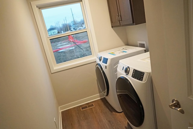 19 Conner St, Wabash, IN 46992 - laundry area featuring cabinet space, washer and clothes dryer, dark wood-type flooring, and baseboards