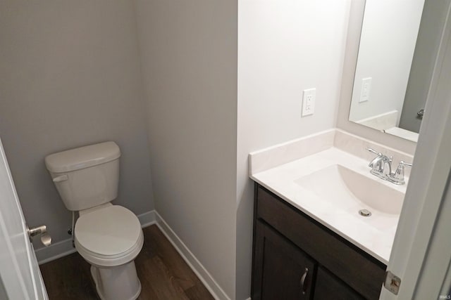19 Conner St, Wabash, IN 46992 - bathroom with vanity, wood finished floors, toilet, and baseboards