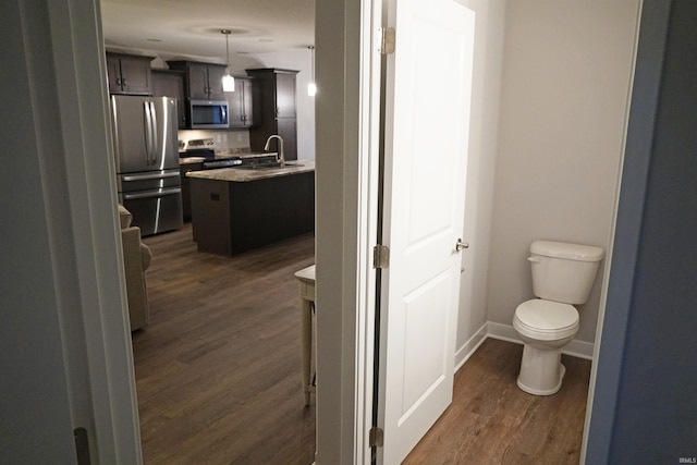 19 Conner St, Wabash, IN 46992 - bathroom with vanity, wood finished floors, toilet, and baseboards