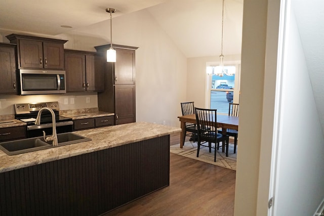 19 Conner St, Wabash, IN 46992 - kitchen with appliances with stainless steel finishes, a sink, dark wood-type flooring, dark brown cabinets, and a chandelier