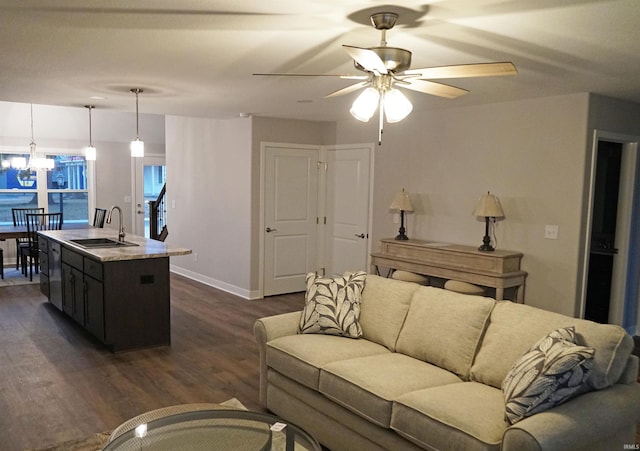 19 Conner St, Wabash, IN 46992 - living room featuring dark wood-style flooring, ceiling fan, a chandelier, and baseboards