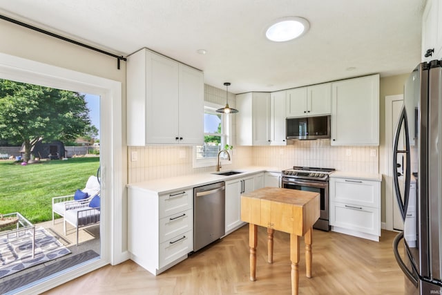 5987 E 100 N, Franklin, IN 46131 - kitchen featuring stainless steel appliances, a sink, light countertops, and white cabinets