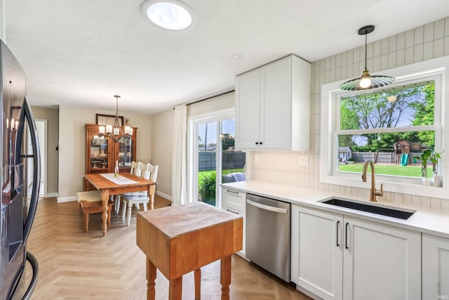 5987 E 100 N, Franklin, IN 46131 - kitchen with appliances with stainless steel finishes, a sink, white cabinets, and light countertops