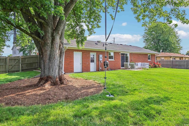 5987 E 100 N, Franklin, IN 46131 - back of property with an outdoor hangout area, brick siding, and a patio area