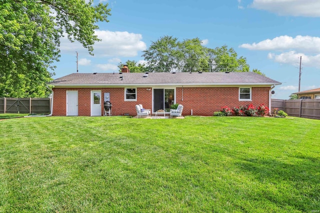 5987 E 100 N, Franklin, IN 46131 - back of house featuring brick siding, a patio, and a chimney