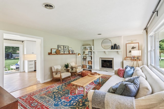 5987 E 100 N, Franklin, IN 46131 - living area featuring a brick fireplace and baseboards