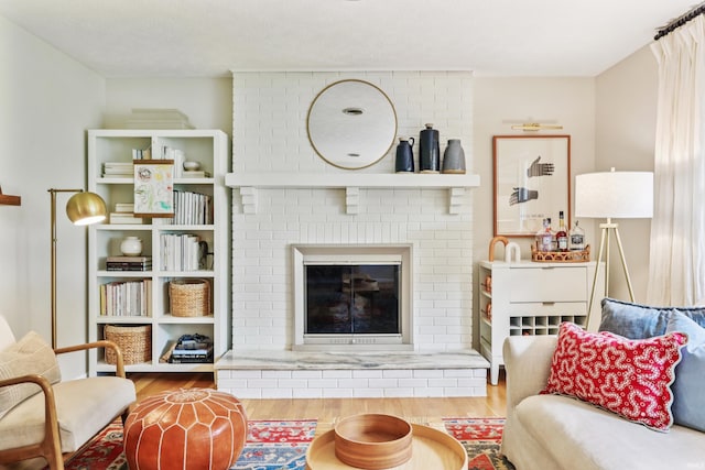 5987 E 100 N, Franklin, IN 46131 - living room featuring wood finished floors and a brick fireplace
