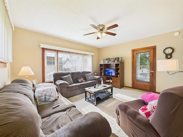 63 S Market St, Andrews, IN 46702 - living area featuring ceiling fan, healthy amount of natural light, and light colored carpet