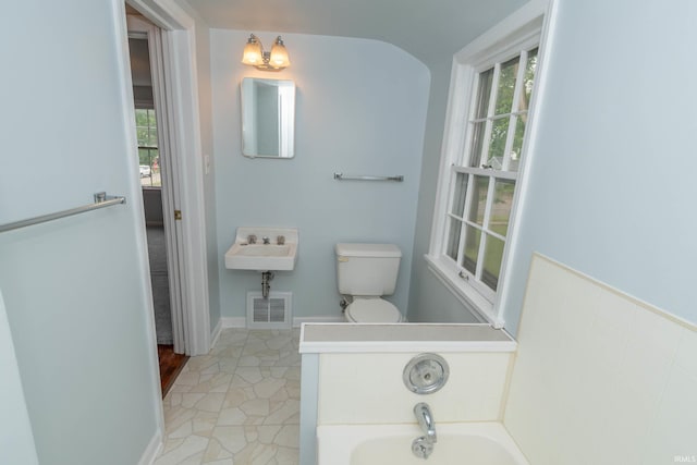 1307 Cassopolis St, Elkhart, IN 46514 - bathroom with a garden tub and toilet