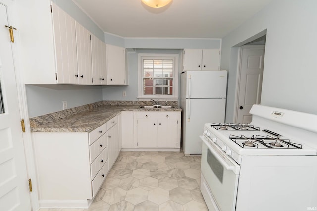 1307 Cassopolis St, Elkhart, IN 46514 - kitchen featuring white appliances, a sink, and light stone counters