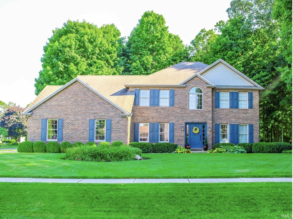 58679 Baugo Xing, Elkhart, IN 46517 - colonial house with brick siding and a front yard