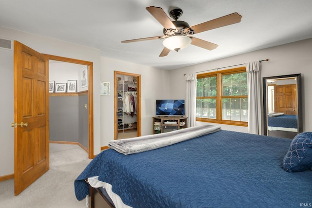 58679 Baugo Xing, Elkhart, IN 46517 - bedroom featuring light colored carpet, a spacious closet, a ceiling fan, and a closet