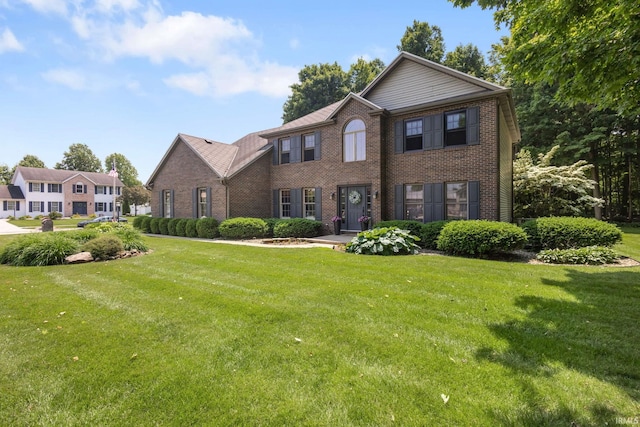 58679 Baugo Xing, Elkhart, IN 46517 - colonial house featuring brick siding and a front yard