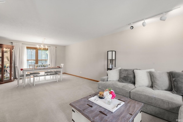 58679 Baugo Xing, Elkhart, IN 46517 - living room featuring track lighting, light colored carpet, and a chandelier