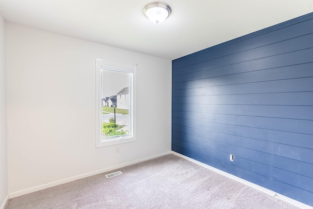 2502 Trillium Cv, Huntertown, IN 46748 - carpeted spare room with baseboards and wood walls