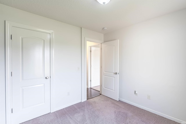 2502 Trillium Cv, Huntertown, IN 46748 - unfurnished bedroom with light carpet and baseboards