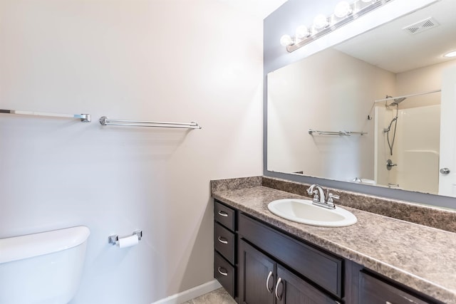 2502 Trillium Cv, Huntertown, IN 46748 - bathroom with toilet, vanity, baseboards, and shower / tub combination