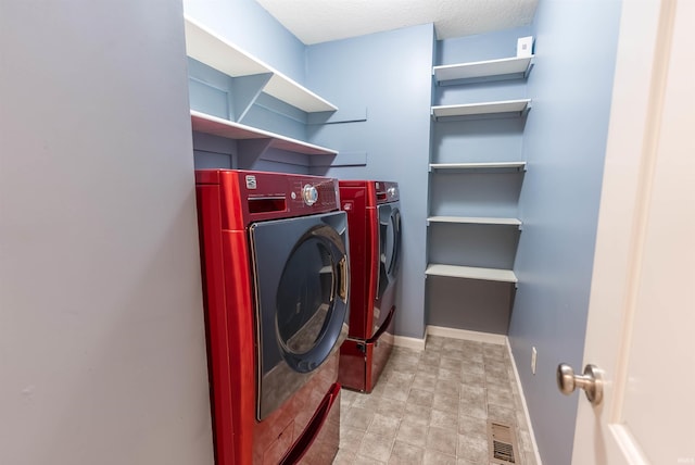 2502 Trillium Cv, Huntertown, IN 46748 - laundry area featuring separate washer and dryer and baseboards