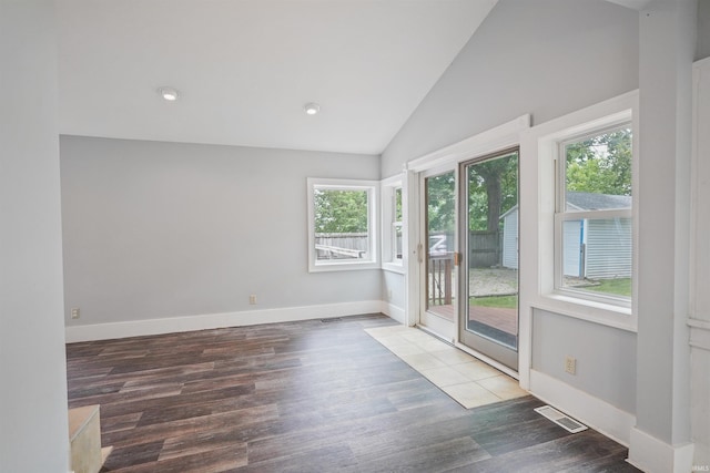 618 N Lake St, Warsaw, IN 46580 - empty room with vaulted ceiling, wood finished floors, baseboards, and recessed lighting