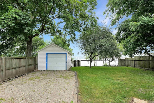 618 N Lake St, Warsaw, IN 46580 - view of yard featuring a detached garage, an outdoor structure, and driveway