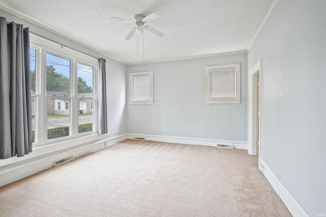 618 N Lake St, Warsaw, IN 46580 - empty room with carpet floors, a textured ceiling, ceiling fan, ornamental molding, and baseboards