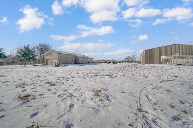 4627 E 100th Hwy N, Monticello, IN 47960 - yard layered in snow with a garage