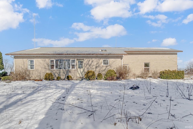 4627 E 100th Hwy N, Monticello, IN 47960 - snow covered rear of property featuring brick siding