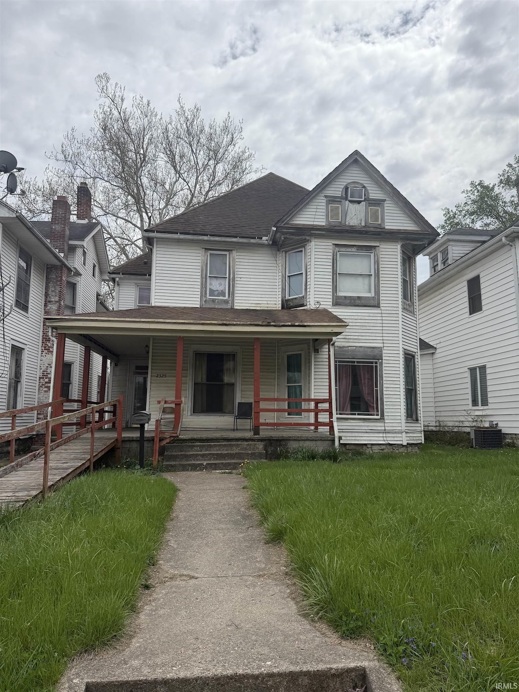 2325 E Broadway St, Logansport, IN 46947 - victorian-style house featuring covered porch and central air condition unit