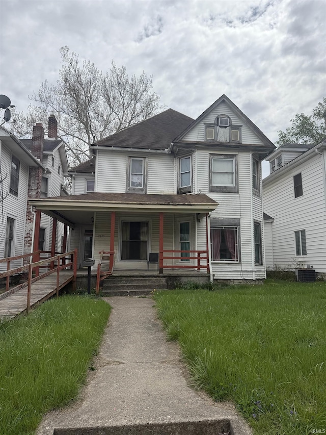 2325 E Broadway St, Logansport, IN 46947 - victorian-style house featuring covered porch and central air condition unit