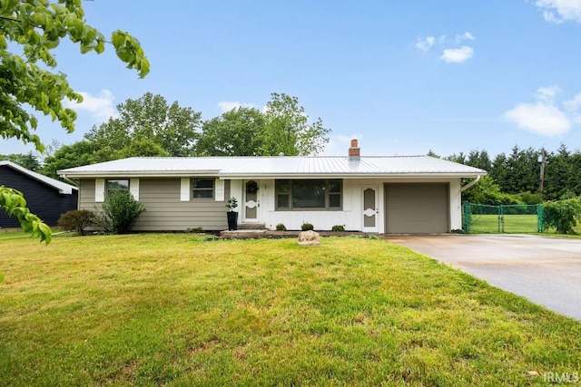 19109 Sandy Dr, Goshen, IN 46528 - ranch-style home featuring a chimney, a garage, board and batten siding, concrete driveway, and metal roof