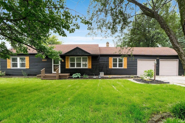 4654 Schmucker Dr, Fort Wayne, IN 46835 - ranch-style house featuring driveway, a garage, and a front lawn