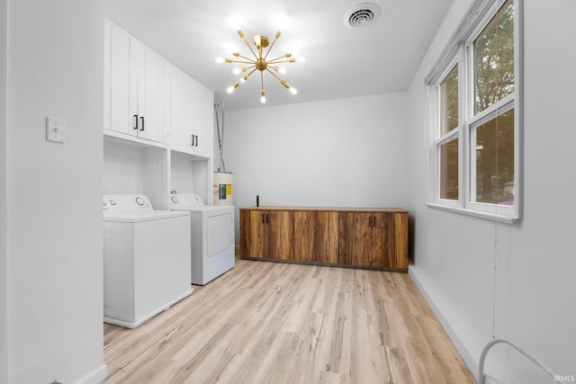 4654 Schmucker Dr, Fort Wayne, IN 46835 - laundry room featuring cabinet space, independent washer and dryer, a chandelier, light wood-type flooring, and baseboards