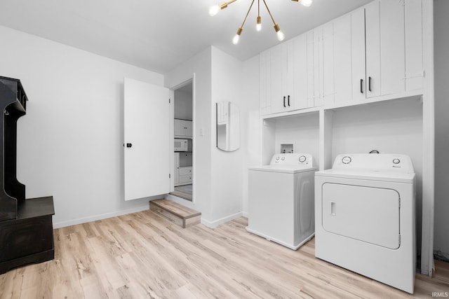 4654 Schmucker Dr, Fort Wayne, IN 46835 - laundry room featuring washer and dryer, light wood-style flooring, a chandelier, cabinet space, and baseboards