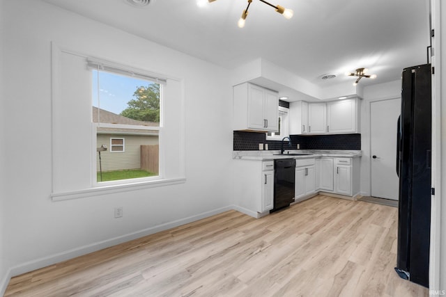 4654 Schmucker Dr, Fort Wayne, IN 46835 - kitchen featuring black appliances, a sink, light countertops, and light wood-style flooring