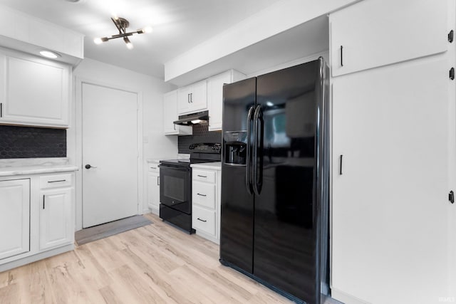 4654 Schmucker Dr, Fort Wayne, IN 46835 - kitchen with black appliances, backsplash, under cabinet range hood, and white cabinetry