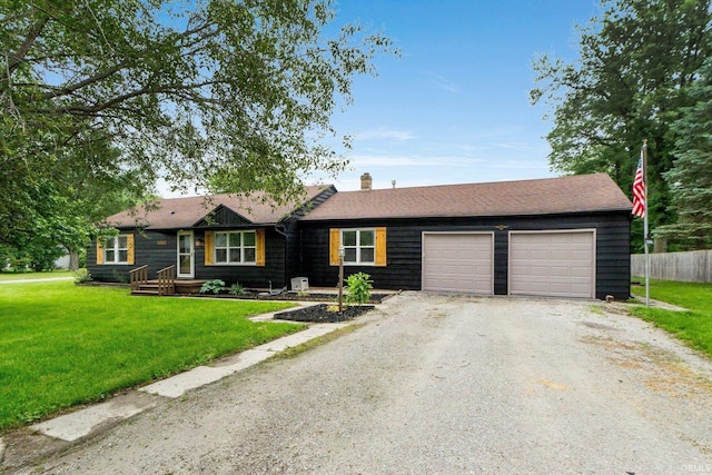 4654 Schmucker Dr, Fort Wayne, IN 46835 - ranch-style house with driveway, an attached garage, and a chimney