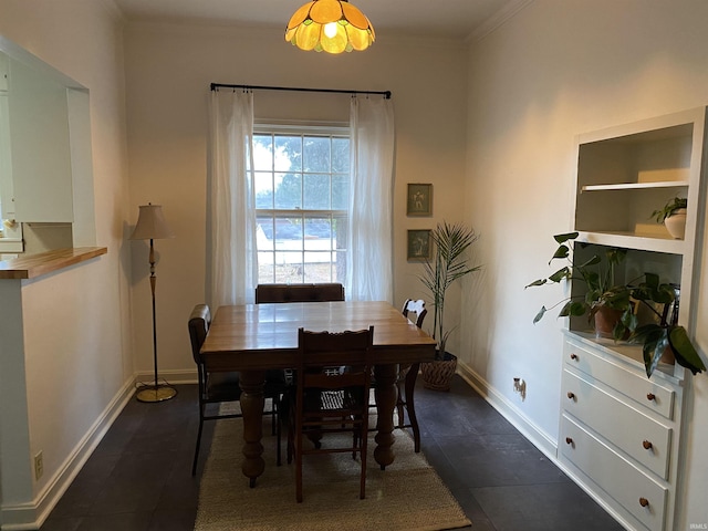 5425 Lincoln Ave, Evansville, IN 47715 - dining room with dark tile patterned flooring, baseboards, and ornamental molding